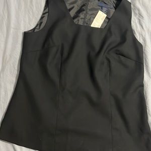 Fully lined black top with zipper in back.
